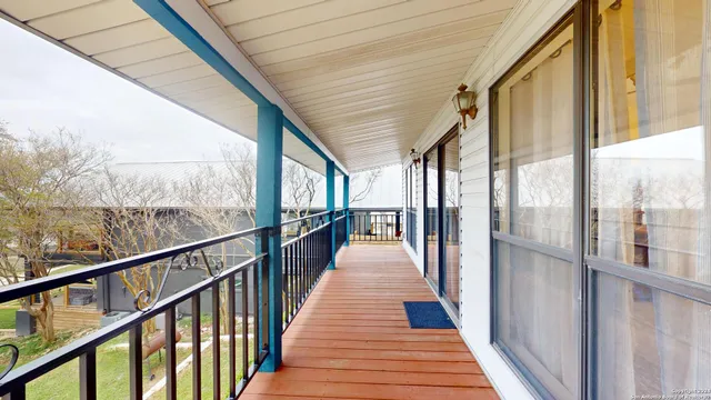 a view of balcony with wooden floor