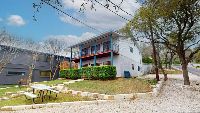 a view of a patio with a yard