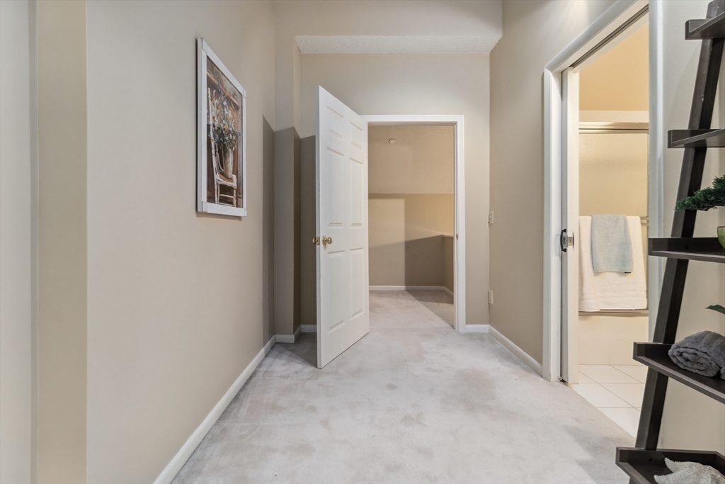 65 Lake Avenue, Unit 1008 Worcester, MA 01604 - Photo 22 of 35 a view of a hallway with a livingroom and a window