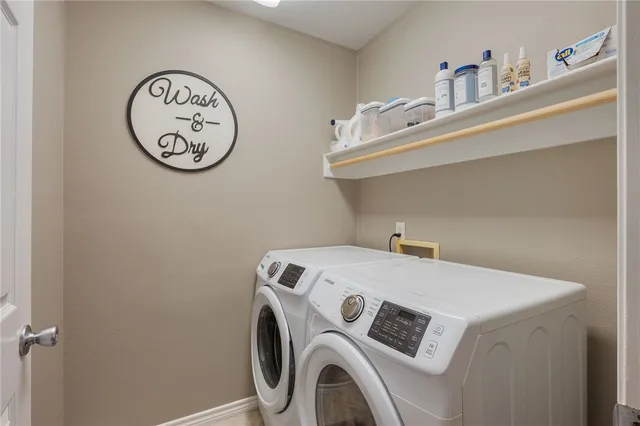 a utility room with dryer and washer