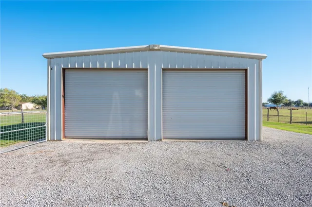 a view of backyard with a small cabin