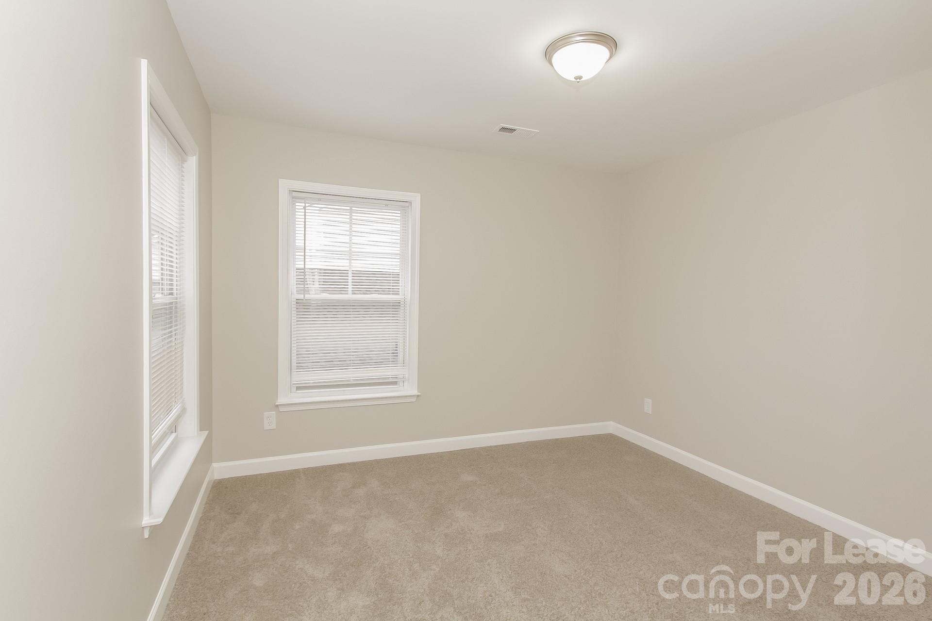 11004 Greenhead View Road Charlotte, NC 28262 - Photo 13 of 17 an empty room with a window