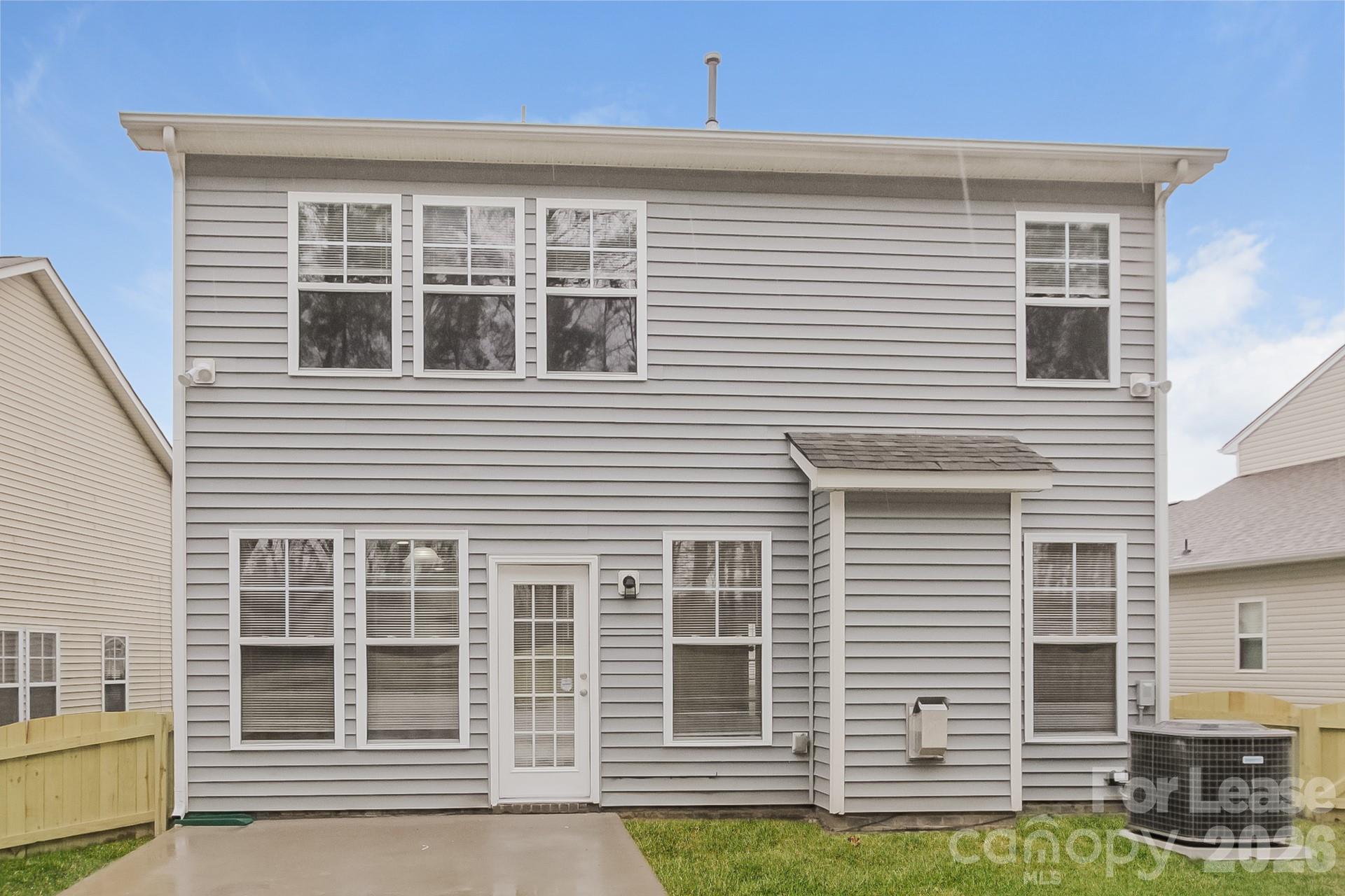 11004 Greenhead View Road Charlotte, NC 28262 - Photo 15 of 17 a front view of a house with a yard