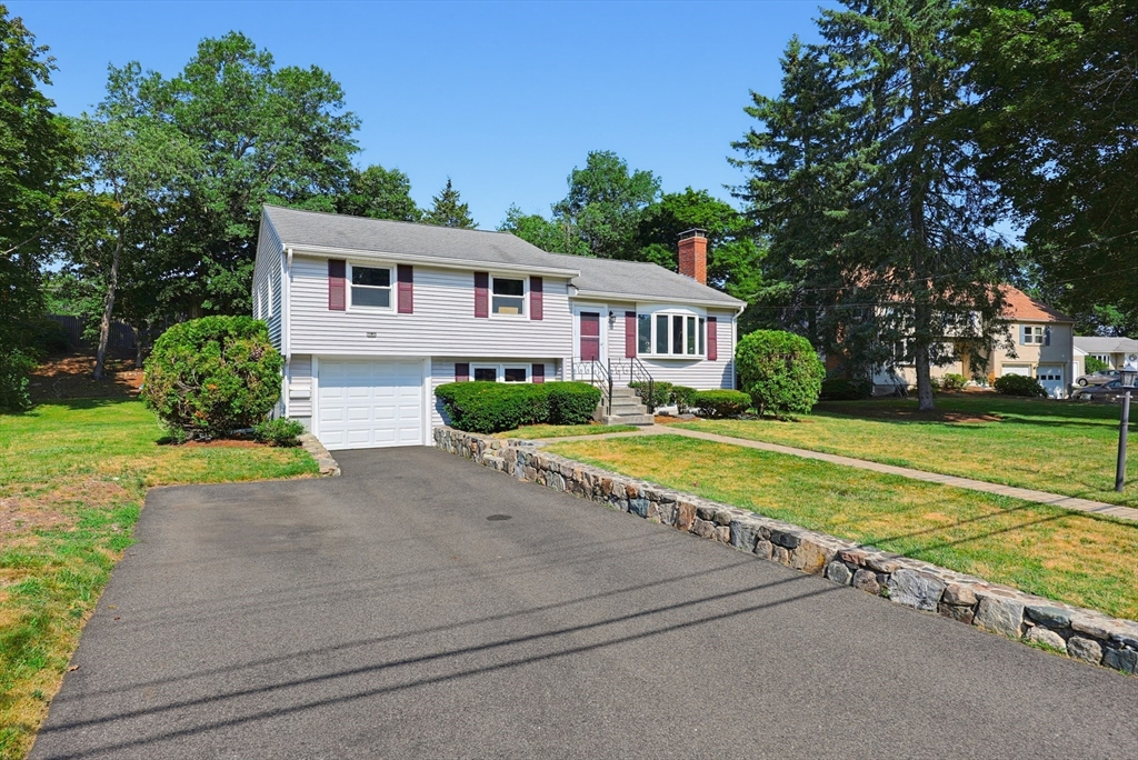 19 Weir Road Waltham, MA 02451 - Photo 1 of 41 a house with garden in front of it