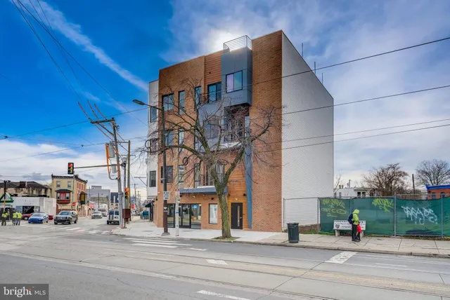 a front view of building with street