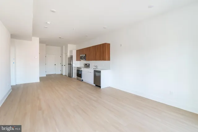 a view of kitchen and wooden floor