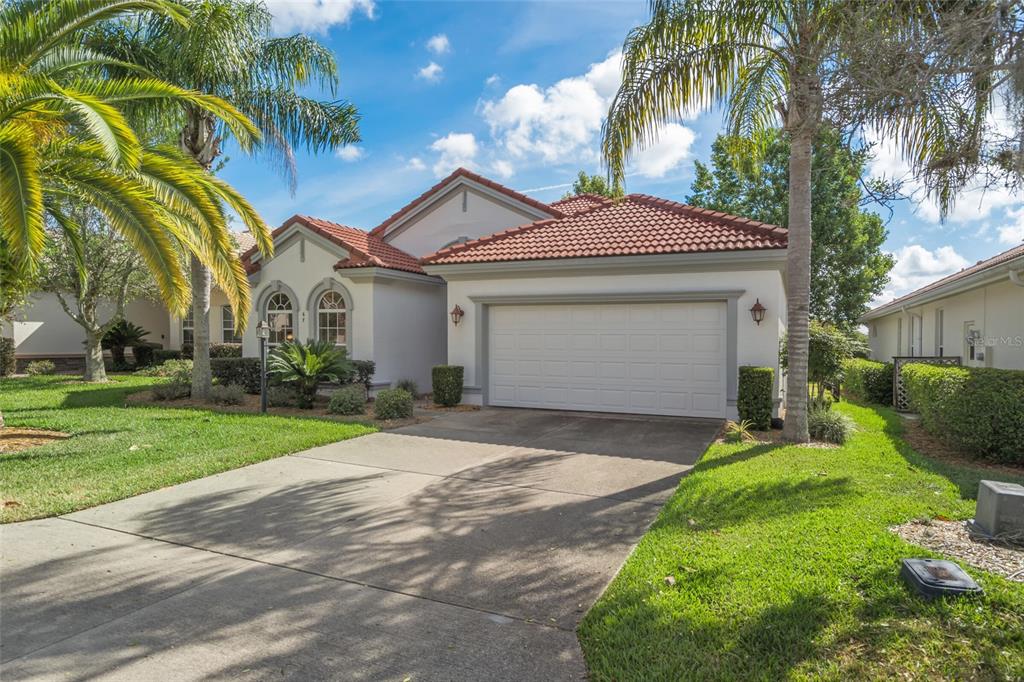 67 West Doerr Path Hernando, FL 34442 - Photo 1 of 1 a front view of a house with a yard and garage