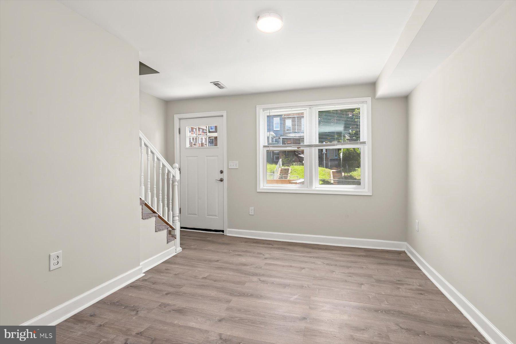1044 Ellicott Driveway Baltimore, MD 21216 - Photo 3 of 26 an empty room with windows