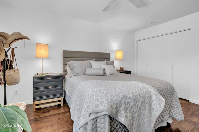 a bed room with a bed and a night stand