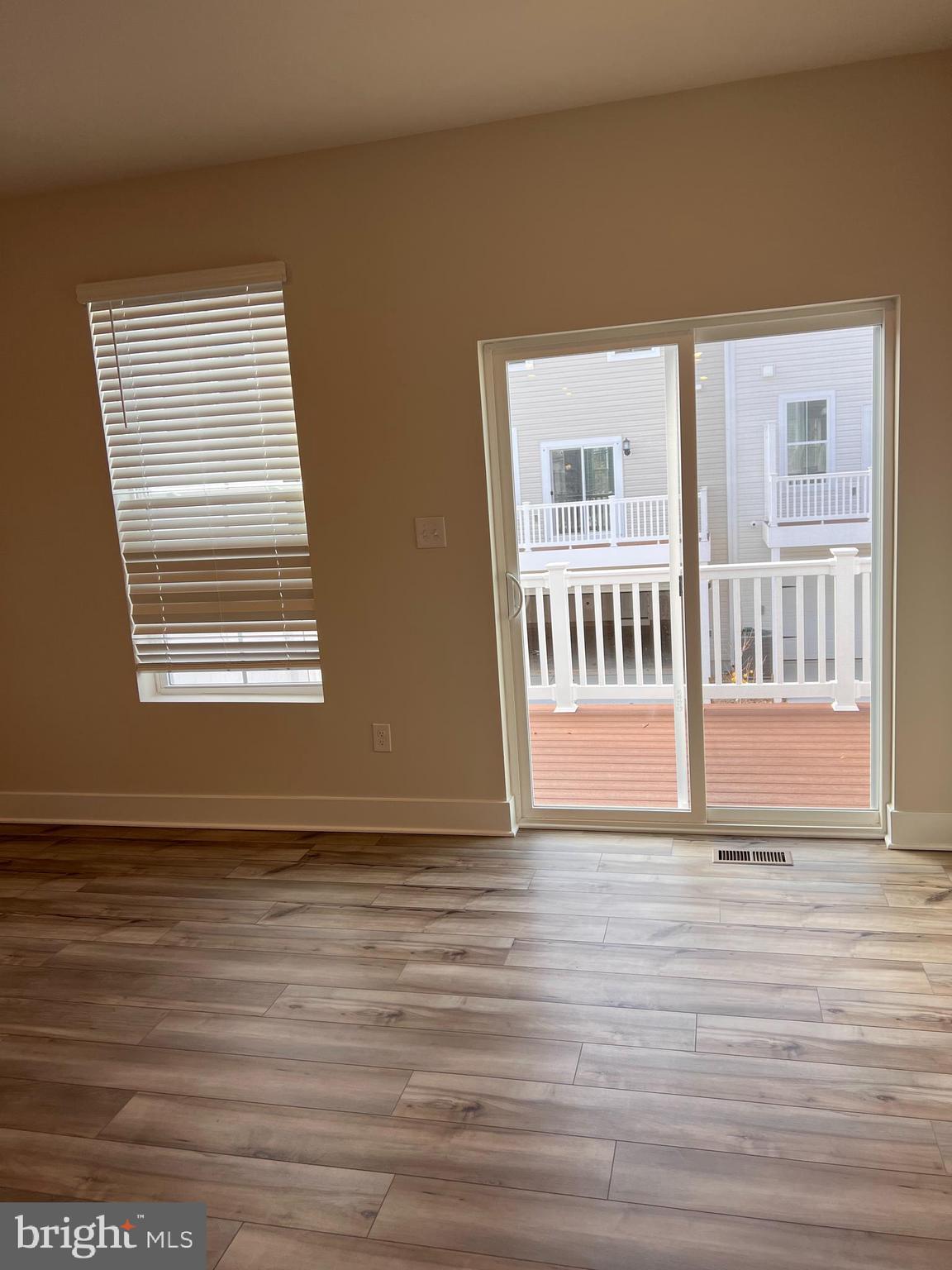 13931 Anderson Garden Road Laurel, MD 20707 - Photo 21 of 32 a view of wooden floor and windows in a room