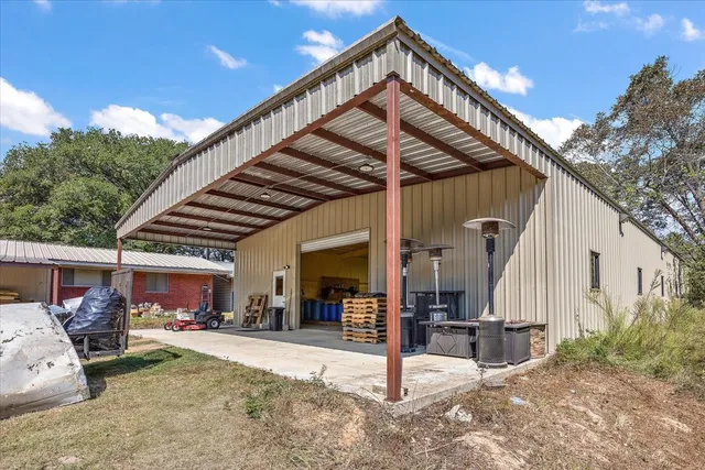 a dining hall with stainless steel appliances refrigerator dining table and chairs