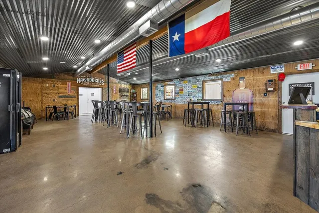 a kitchen with a stove a cabinets and wooden floor