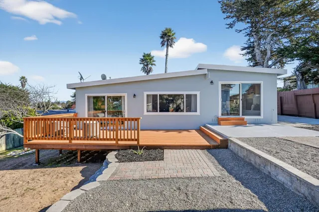 a view of a house with a snow in the yard