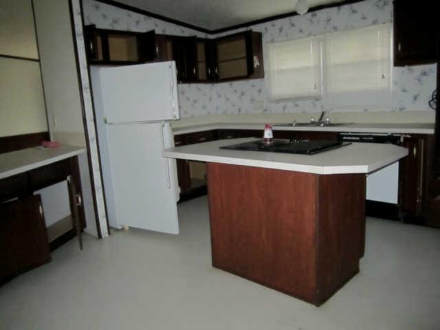 2243 Kimbrough Road Prospect, TN 38477 - Photo 10 of 20 a kitchen with a sink and a refrigerator