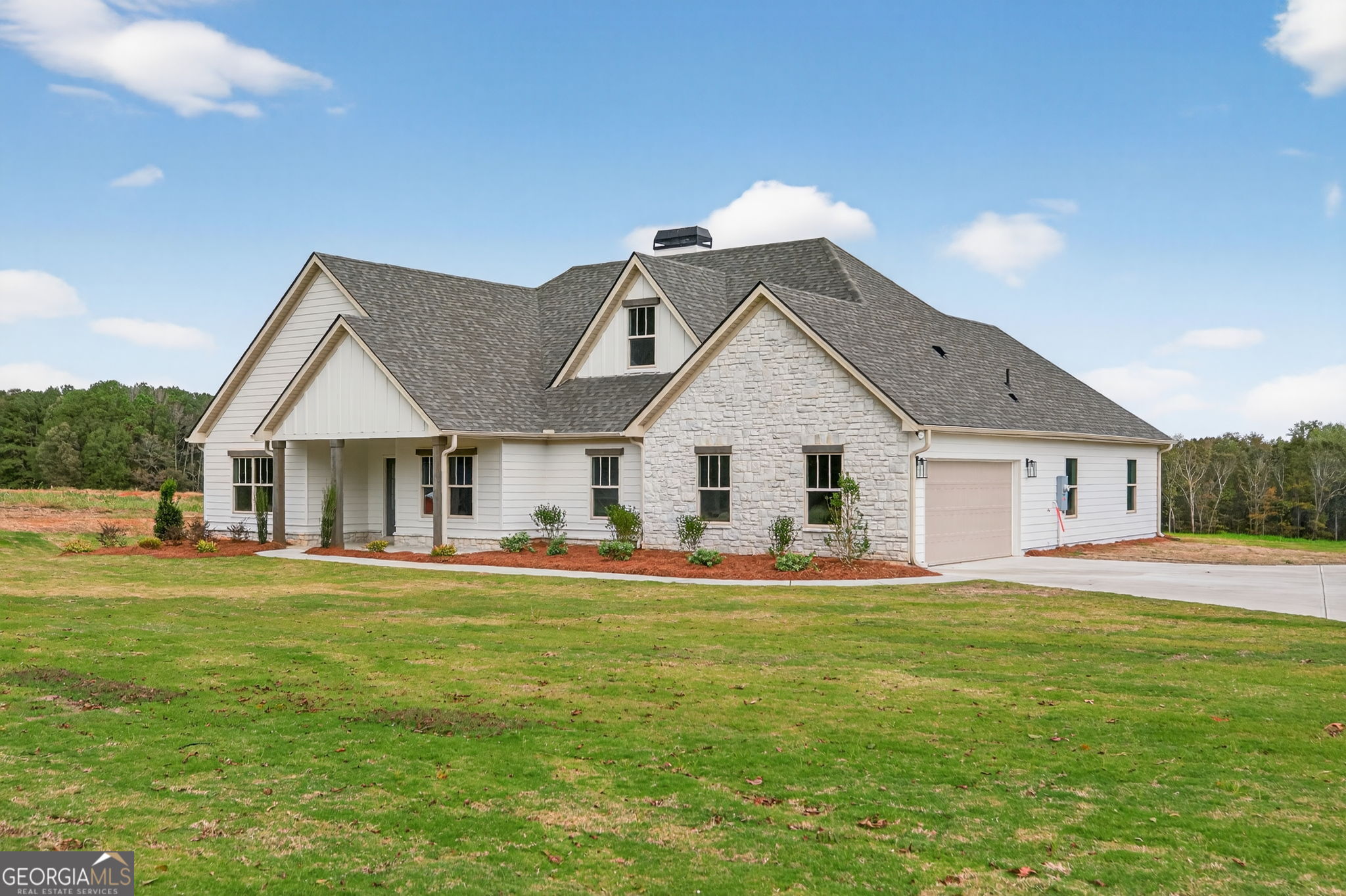 359 Gray Road Roopville, GA 30170 - Photo 3 of 46 a front view of a house with a yard and garage
