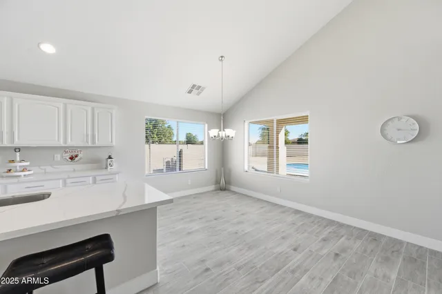 a view of kitchen with window and wooden floor