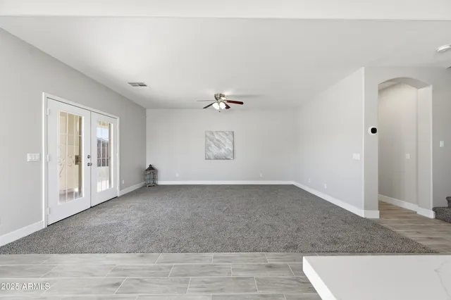 a view of kitchen with furniture and a ceiling fan