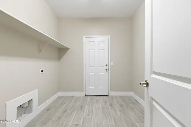 a view of empty room with ceiling fan