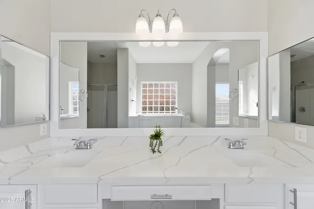 a view of a livingroom with a ceiling fan and window
