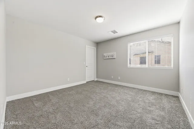 a bathroom with a double vanity sink toilet and shower