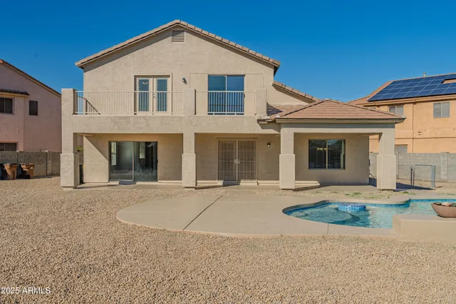 an aerial view of a house with a ocean view