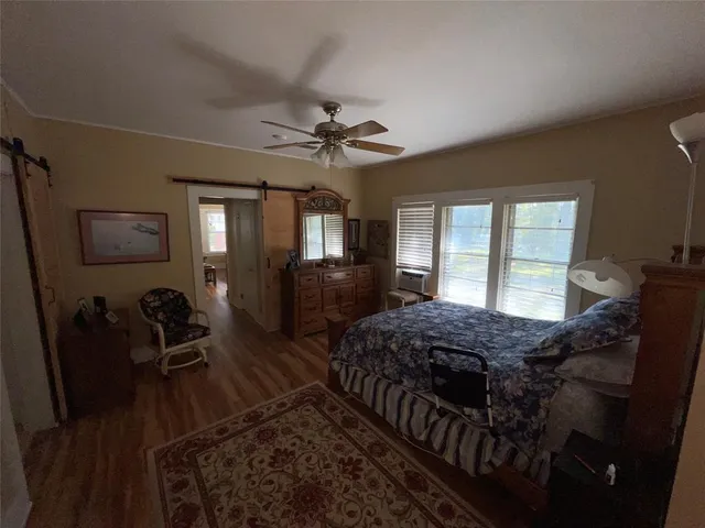 a living room with large couches and a rug