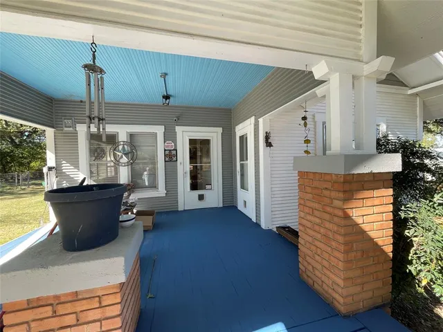a view of a living room and entryway
