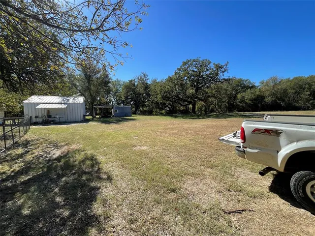 a view of backyard with green space