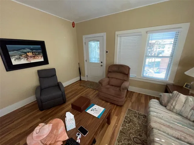 a living room with furniture and a window