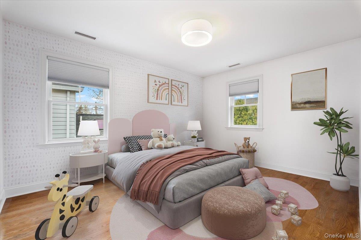 109 Lee Road Scarsdale, NY 10583 - Photo 16 of 30 a bedroom with two beds and potted plant