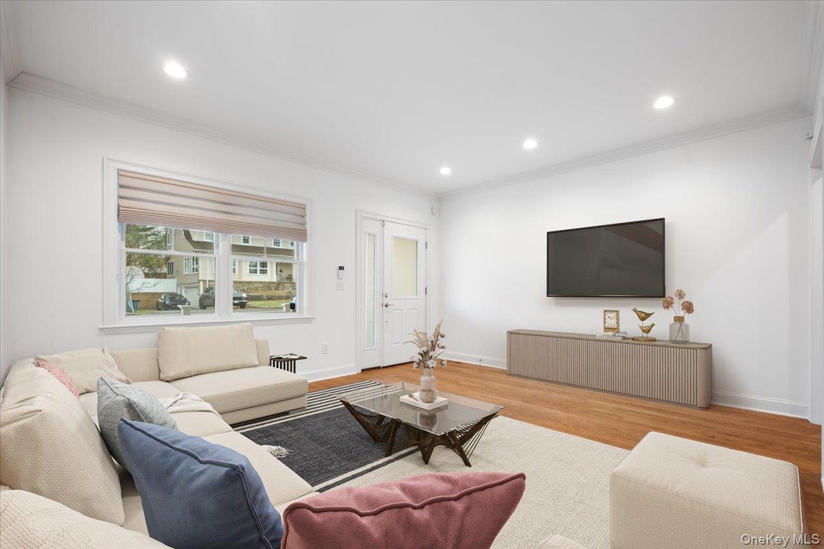109 Lee Road Scarsdale, NY 10583 - Photo 2 of 30 a living room with furniture and a flat screen tv