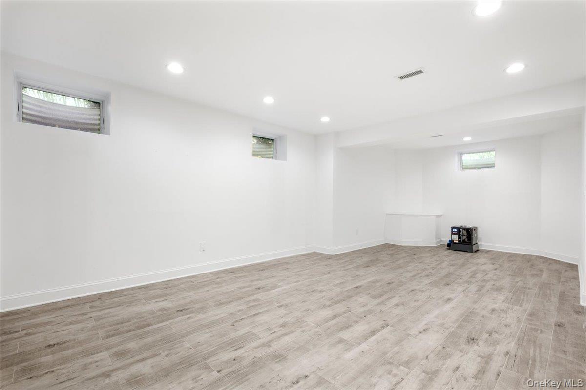 109 Lee Road Scarsdale, NY 10583 - Photo 22 of 30 a view of an empty room with wooden floor