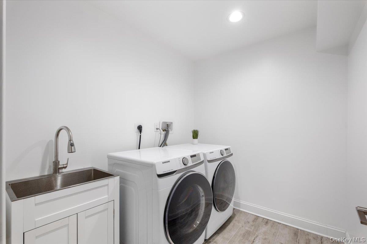 109 Lee Road Scarsdale, NY 10583 - Photo 24 of 30 a utility room with dryer and washer