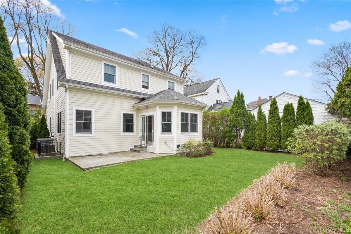 109 Lee Road Scarsdale, NY 10583 - Photo 25 of 30 a front view of a house with a yard and porch