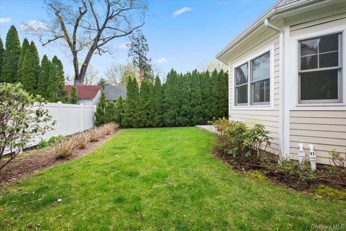 109 Lee Road Scarsdale, NY 10583 - Photo 27 of 30 a view of a house with a backyard
