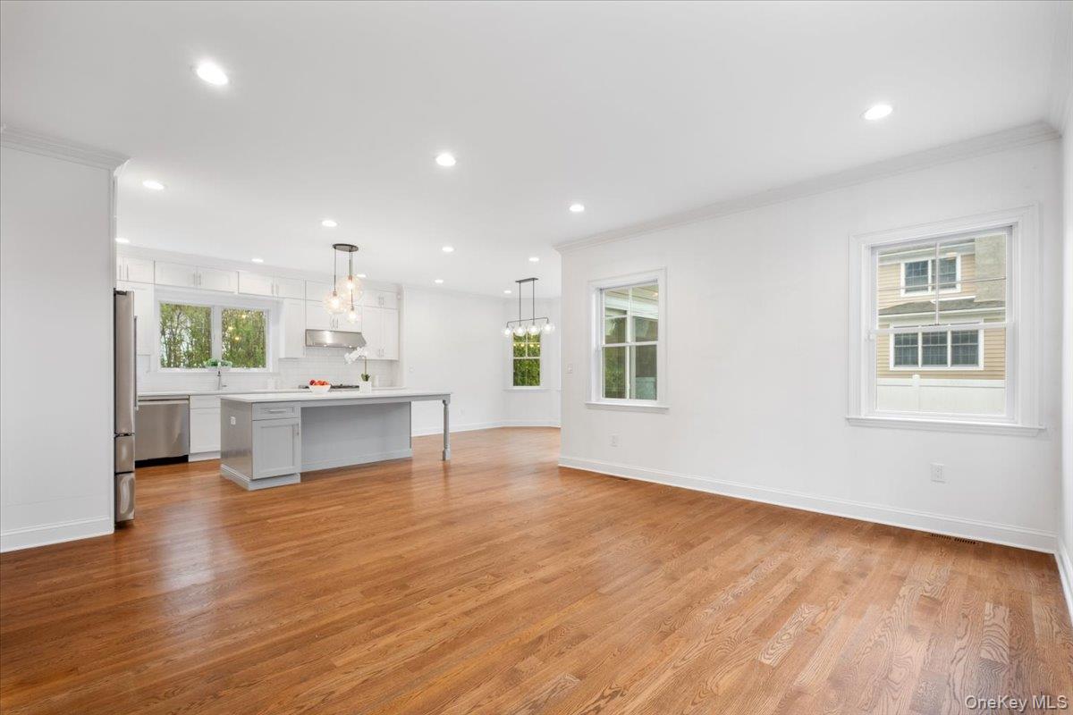 109 Lee Road Scarsdale, NY 10583 - Photo 7 of 30 a living room with stainless steel appliances kitchen island wooden floor and view living room