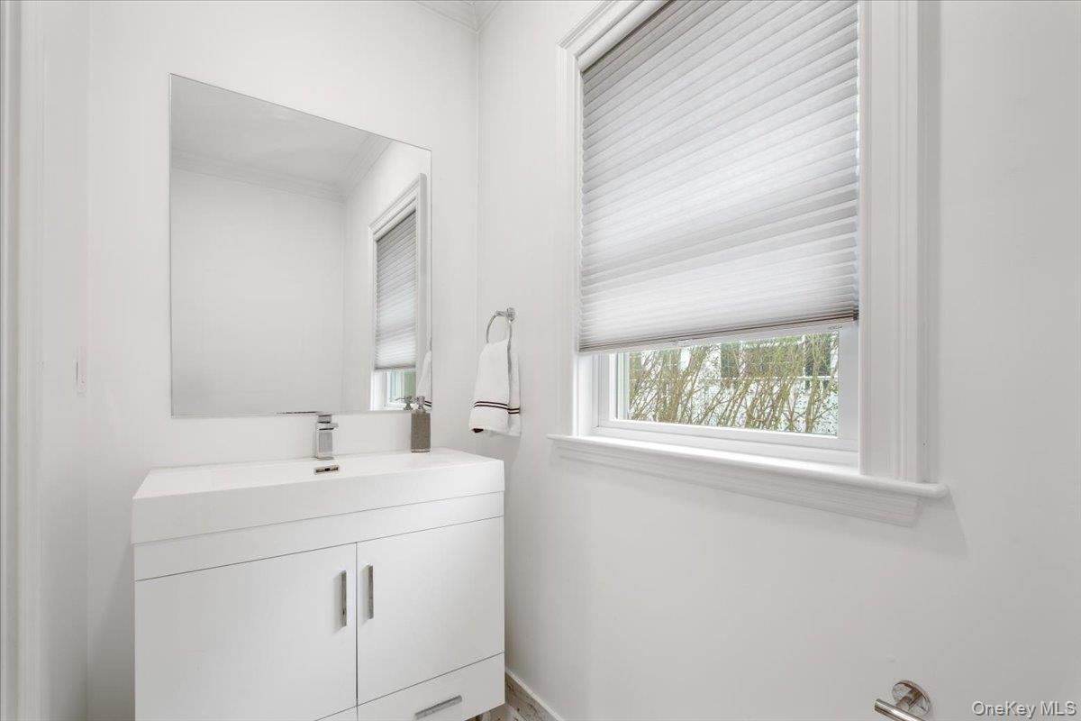 109 Lee Road Scarsdale, NY 10583 - Photo 8 of 30 a bathroom with a sink and a mirror