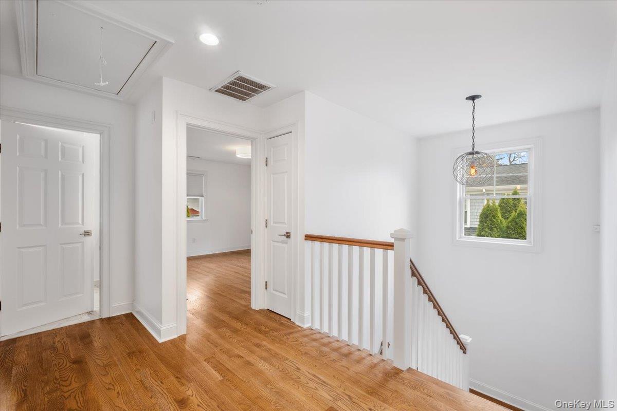 109 Lee Road Scarsdale, NY 10583 - Photo 9 of 30 a view of a hallway with wooden floor
