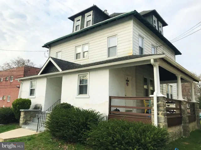 a front view of a house with garage