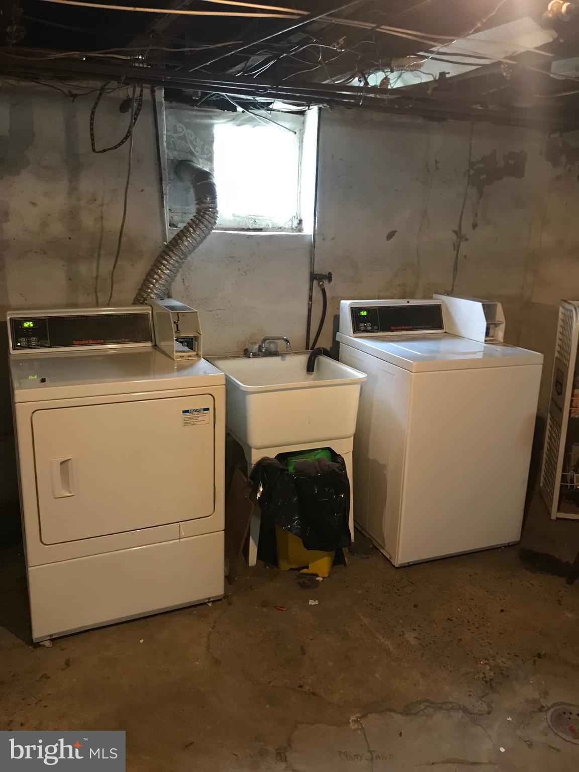 229 Ridley Avenue, Unit 1 Folsom, PA 19033 - Photo 13 of 13 a utility room with dryer and washer