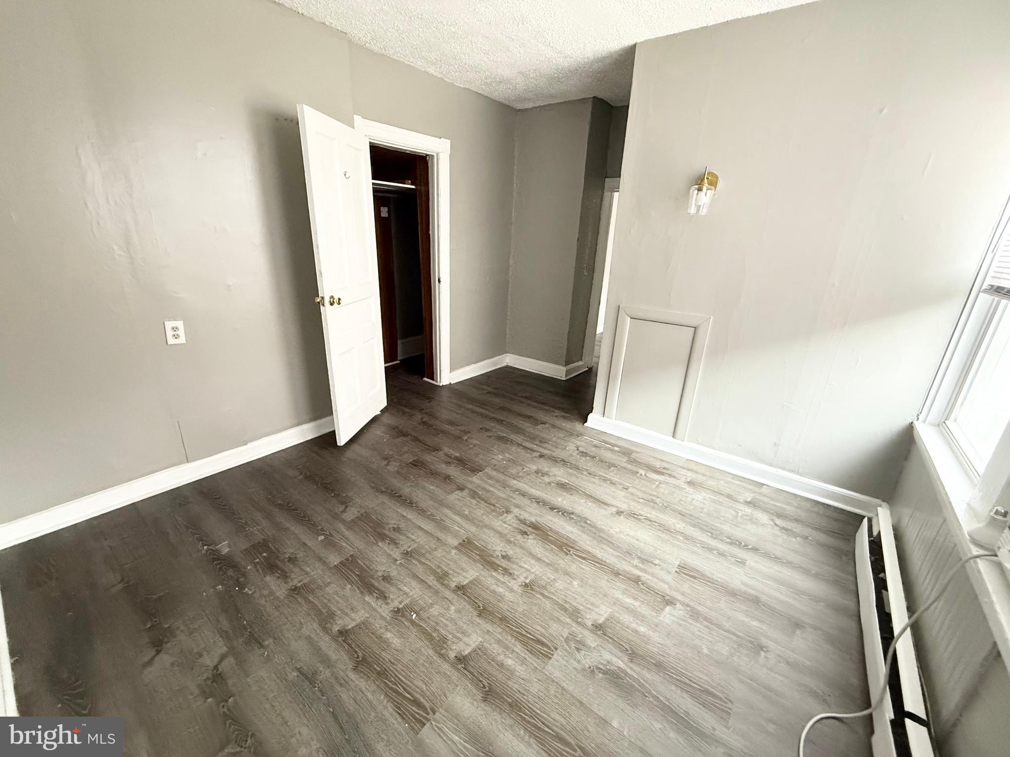 229 Ridley Avenue, Unit 1 Folsom, PA 19033 - Photo 7 of 13 a view of empty room with wooden floor