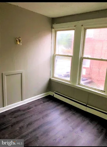 a room with window and wooden floor