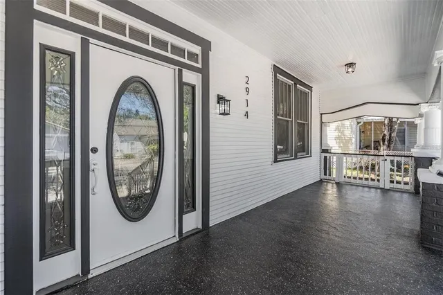 a view of a livingroom with furniture and hardwood floor