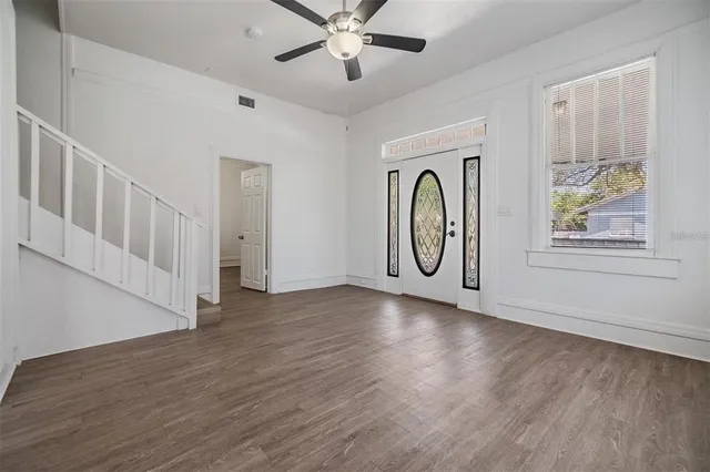 a view of entryway with wooden floor