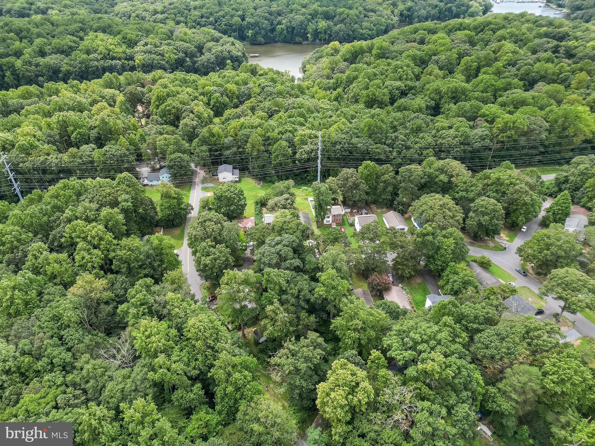 8453 Pine Boulevard Lusby, MD 20657 - Photo 13 of 14 an aerial view of residential house with outdoor space and trees all around