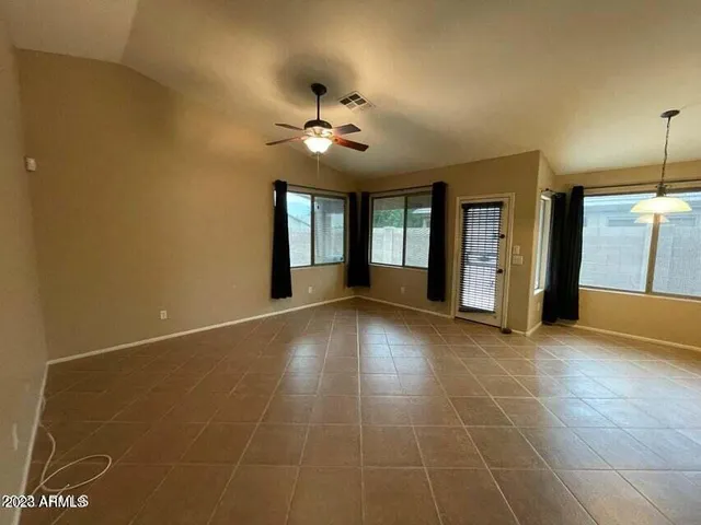 a view of an empty room with glass door