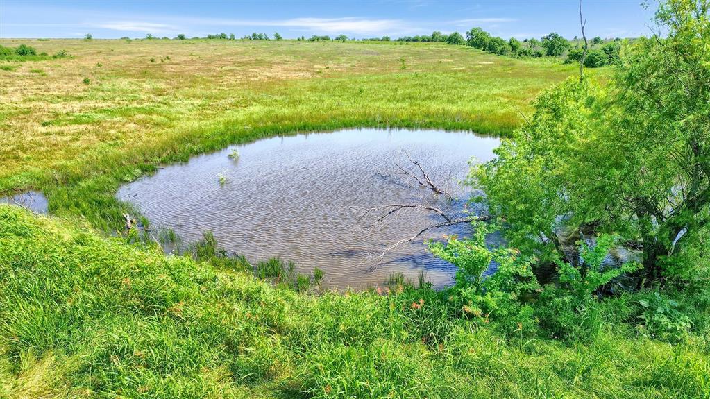 105 A Spalding Road Whitesboro, TX 76273 - Photo 11 of 30 a view of an ocean with a building in the background