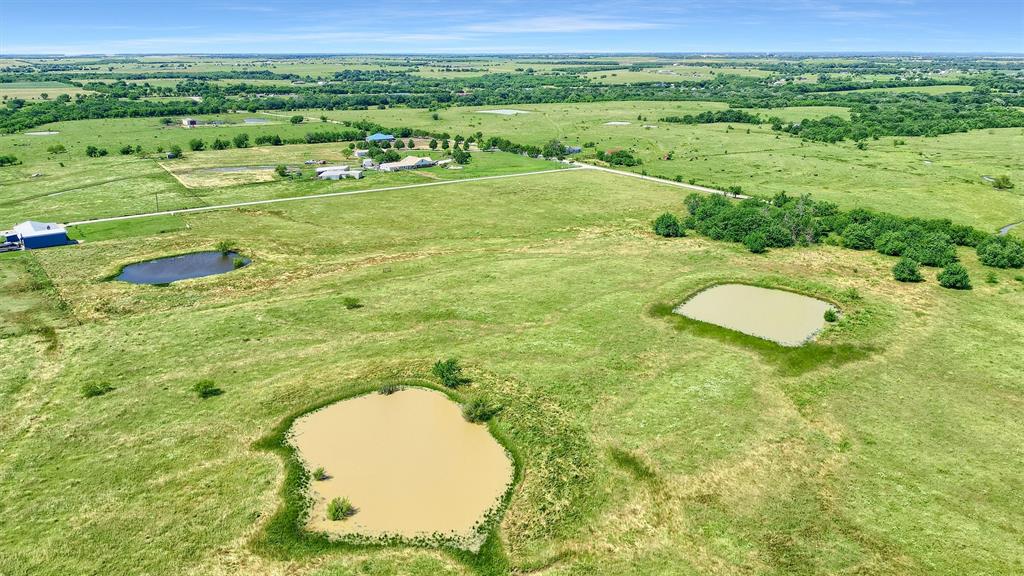 105 A Spalding Road Whitesboro, TX 76273 - Photo 17 of 30 a view of a big room with a big yard