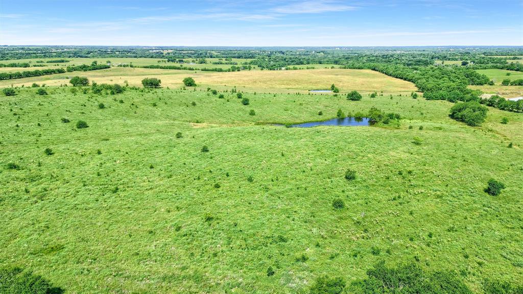 105 A Spalding Road Whitesboro, TX 76273 - Photo 18 of 30 a view of a garden with an outdoor space and seating area
