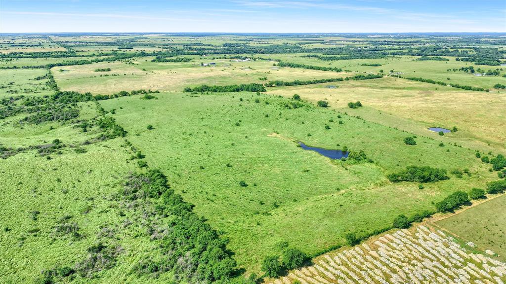 105 A Spalding Road Whitesboro, TX 76273 - Photo 19 of 30 a view of an outdoor space with a lake view